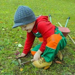 little boy planting